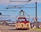 Old vintage Blackpool tram on the promenade of the city under the blue sky