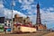 Old vintage Blackpool tram on the promenade of the city under the blue sky and clouds