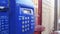 Old, Vintage Blue Telephone with Number Buttons in the Phone Booth