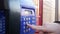 Old, Vintage Blue Telephone with Number Buttons in the Phone Booth