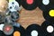 Old vintage bobbins, vinyl records and cassette tapes on a wood table background. Multicolored labels. Top view. Place to copy