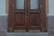 Old vintage brown wood door. Abstract exterior and interior around the entrance