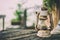 Old vintage camping lantern on wooden table.