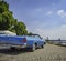 An old vintage car in a car park along the Rhine in Dusseldorf, Germany on a sunny day.