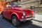 Old vintage car red Fiat parked in city