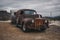 Old vintage caravan and truck abandoned in the desert