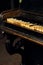 Old vintage classical black piano in dramatic light on dark back