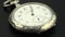 Old vintage clock mechanism watch time going fast . Black background