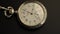 Old vintage clock mechanism watch time going fast . Black background