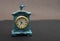 Old vintage clock miniature on table with copy space