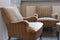 Old vintage comfortable armchair furniture in posh building interior