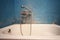 Old vintage dirty water tap in broken bathroom. Trash repairs. Grunge wall background