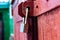 Old vintage door handles. Rusty metal locks and latches. Protective devices for wooden yard