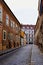 Old vintage European city street with classic architecture. cobblestone pavement