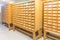 Old vintage file catalog boxes with many wooden index drawers in library archive