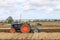 Old  Vintage Fordson tractors ploughing in a ploughing match  stubble in crop field