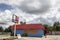 Old vintage gas station closed abandoned red and blue