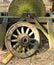 Old vintage grindstone with old wooden wagon wheel