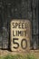 Old vintage grungy spoeed limit 50km road sign Canadian