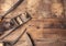 Old vintage hand tools on wooden background.