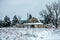 Old vintage historic barn on farm covered in snow