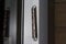 Old vintage Jewish Mezuzah at the entrance to a modern residential building in Israel. Mezuzah, Jewish religion
