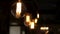 Old vintage lighting in the dark room. Clip. Vintage light bulb. Decorative antique edison style light tungsten bulbs