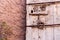 Old vintage massive wooden door with metal locker and handle