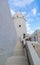 Old vintage Middle Eastern building and tower against the blue sky and clouds - Qasr Al Hosn in Abu Dhabi city