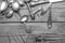 Old vintage ornamented cutlery on a wooden table. black and white photo