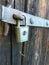 Old Vintage Padlock Lock on Old Wooden Barn Door