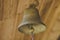 Old vintage peasant brass bell at the entrance
