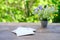 old vintage photographs, bouquet of wild flowers on table wooden table in garden, beautiful blurred natural background with green