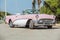 Old vintage pink & white classic car