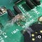 Old vintage printed circuit board with electronic components. Closeup with spider. Dirty, conductor