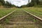 Old vintage railway with wooden sleepers extending to the horizon