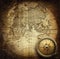 Old vintage retro compass on ancient map background.