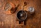 Old vintage retro grinder and coffee beans in cup and spoon top view