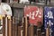 Old vintage retro japanese metal signs and red rice paper lantern where it is written Oshokujidokoro which means Meal on underpass