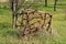 Old vintage retro rusted abandoned agricultural farming equipment used to work with tractors on soil left in family house orchard