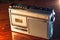 An old, vintage retro style silver boom box or radio cassette tape player