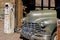 An old vintage rusted car sits in the landscape of Nevada.