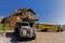 An old vintage rusted car sits in the landscape of Nevada.