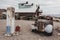 Old vintage rusty car truck abandoned near old fuel pump in the desert