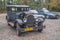 Old vintage rusty Willys blue car parked