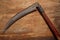 Old vintage scythe of the last century extracted from the chest in the workshop of grandfather. Background for craftsmanship and