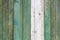 Old vintage shabby green tone weathered painted wood banner background