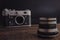 old vintage soviet camera with lens on wooden background