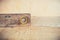 Old vintage spirit level on wooden background