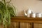 Old vintage teapot and two cup of tea on wooden shelf, antique